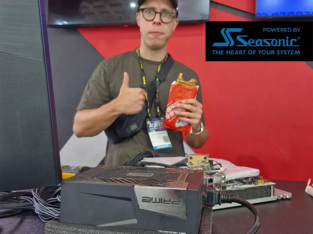 Seasonic PRIME PX PSU on test bench while the champion gives a thumbs-up at the G.SKILL Overclocking World Cup 2025.