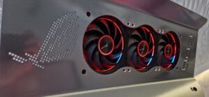Close-up of Seasonic-powered MAXIMUS build by MP-Customized showing triple RGB fans with ROG logo cutout