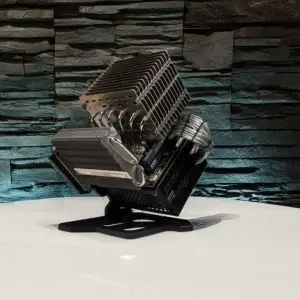 Angled view of Project Silence, a fanless PC mod powered by Seasonic PRIME TX-700, featuring passive cooling design and custom silver cables.