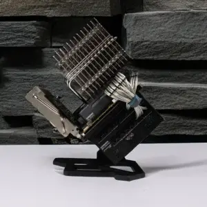 Side profile of Project Silence PC mod, showing passive heatsink fins, Seasonic PRIME TX-700 power supply, and handmade silver custom cables.
