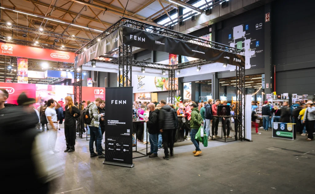 FENN booth at FACTS 2025 featuring Seasonic-powered PC builds and a large visitor crowd.