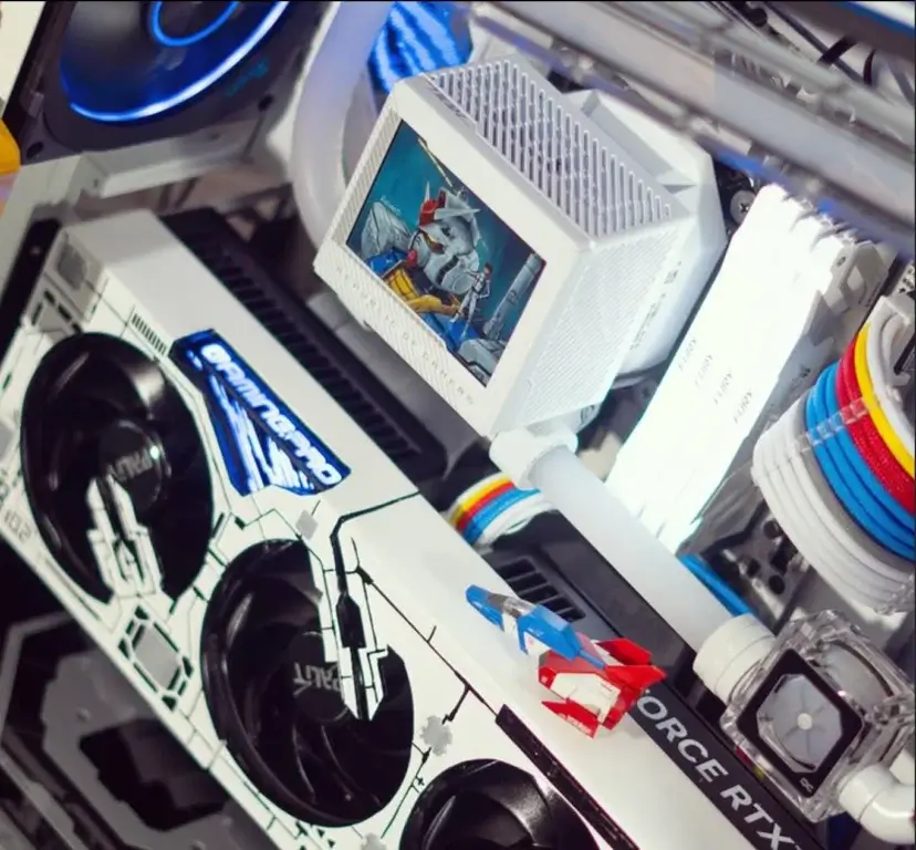 Internal view of the Gundam-themed PC build by Quantum Labs showing GPU, cooling components, and custom layout