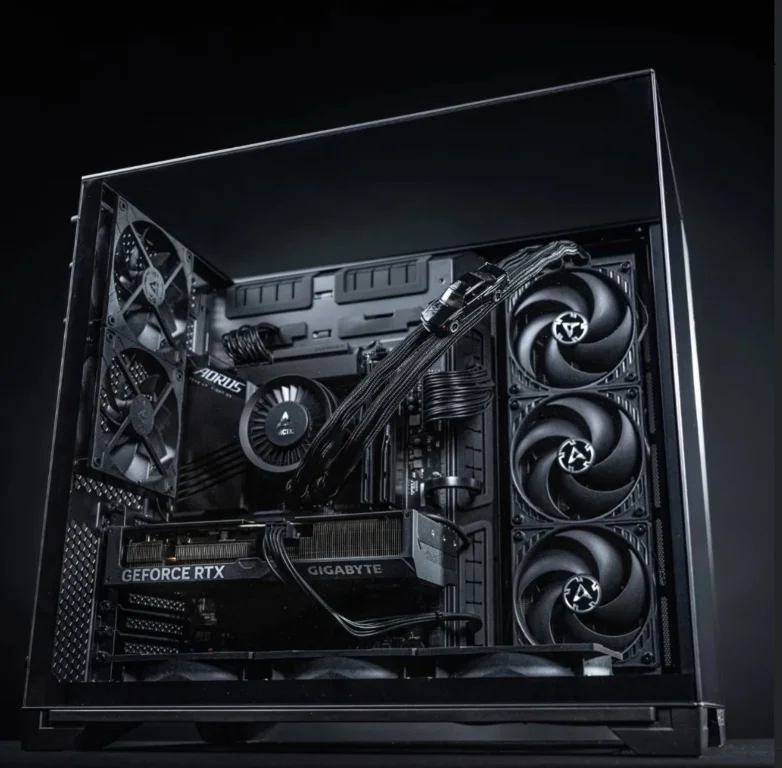 Minimalist black PC build by PC Elegance with refined cable routing and high-end components